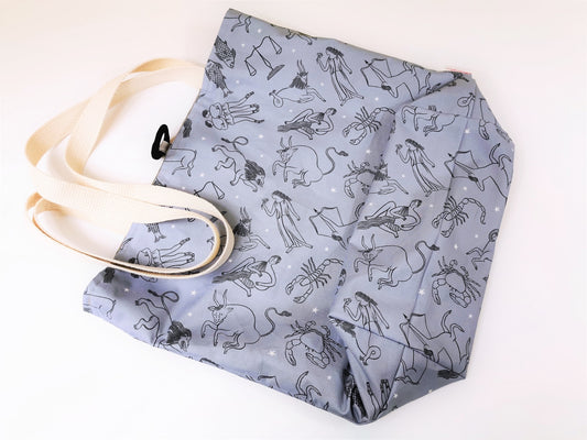 basic tote bag, large reusable cotton shopping bag, compact for purse, sturdy with two layers of fabric, steel blue fabric with zodiac images