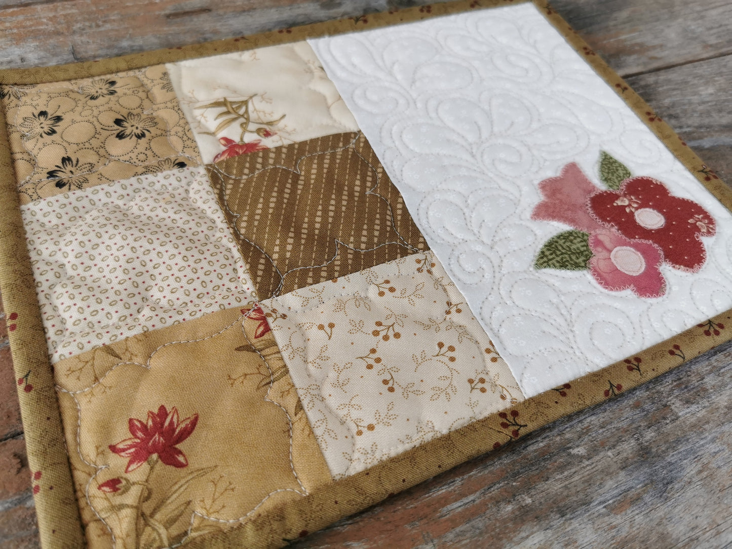 angle view of mug rug with close up of patchwork squares