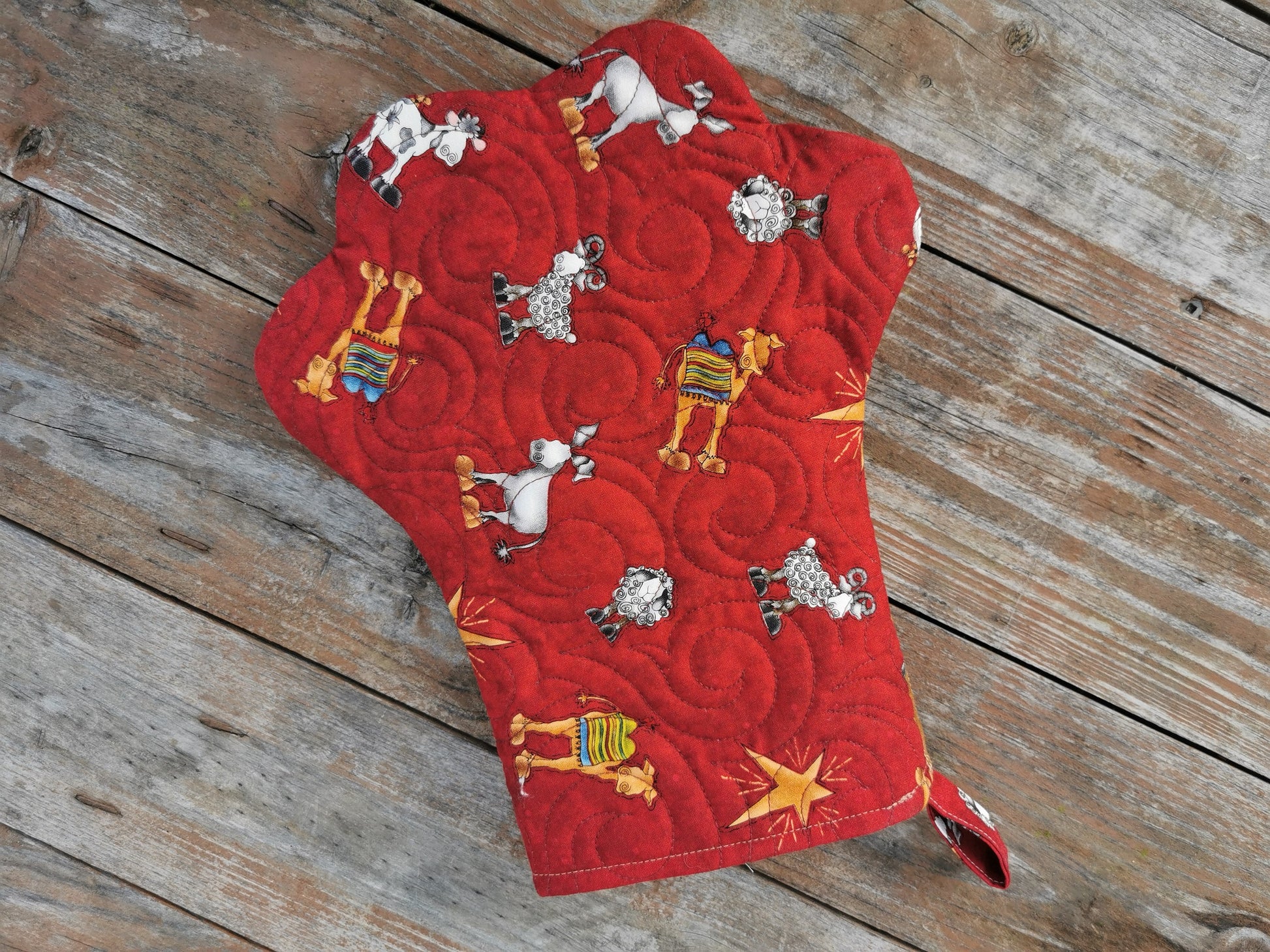 back of paw stocking with Christmas theme fabric