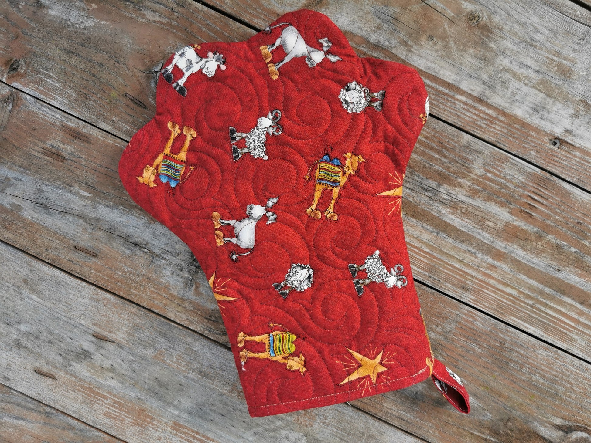 back of paw stocking with Christmas theme fabric