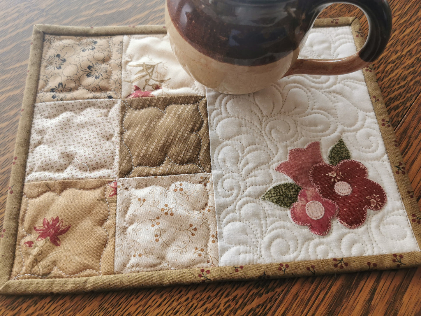 coffee mug sitting on the quilt showing scale