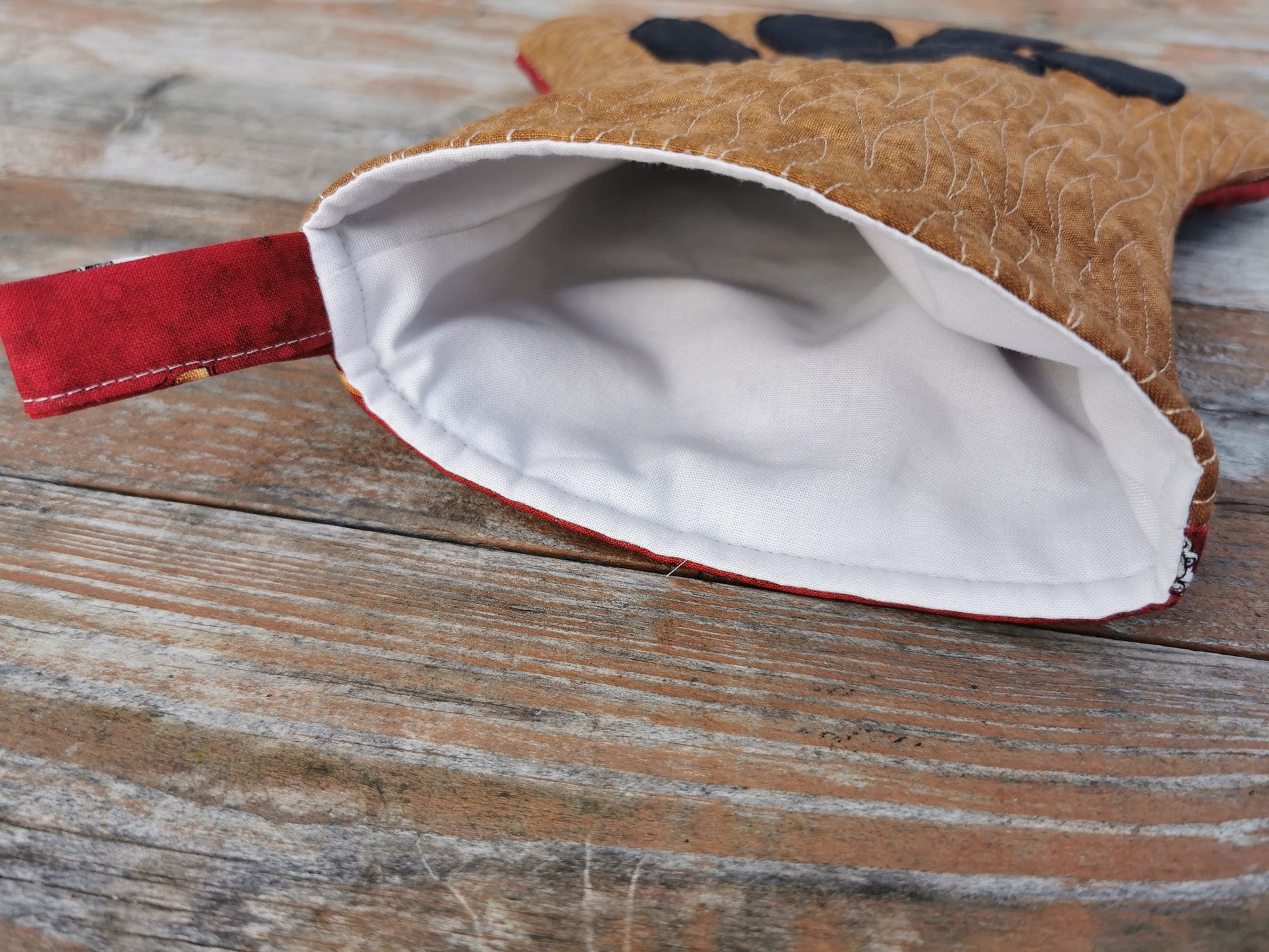 inside view of stocking showing white lining and hanging loop