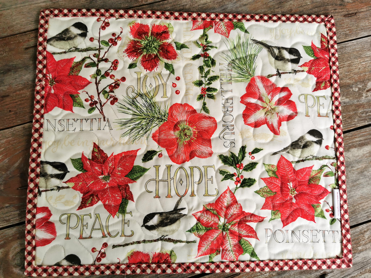 Quilted Christmas Placemats with flowers, chickadee and holly.