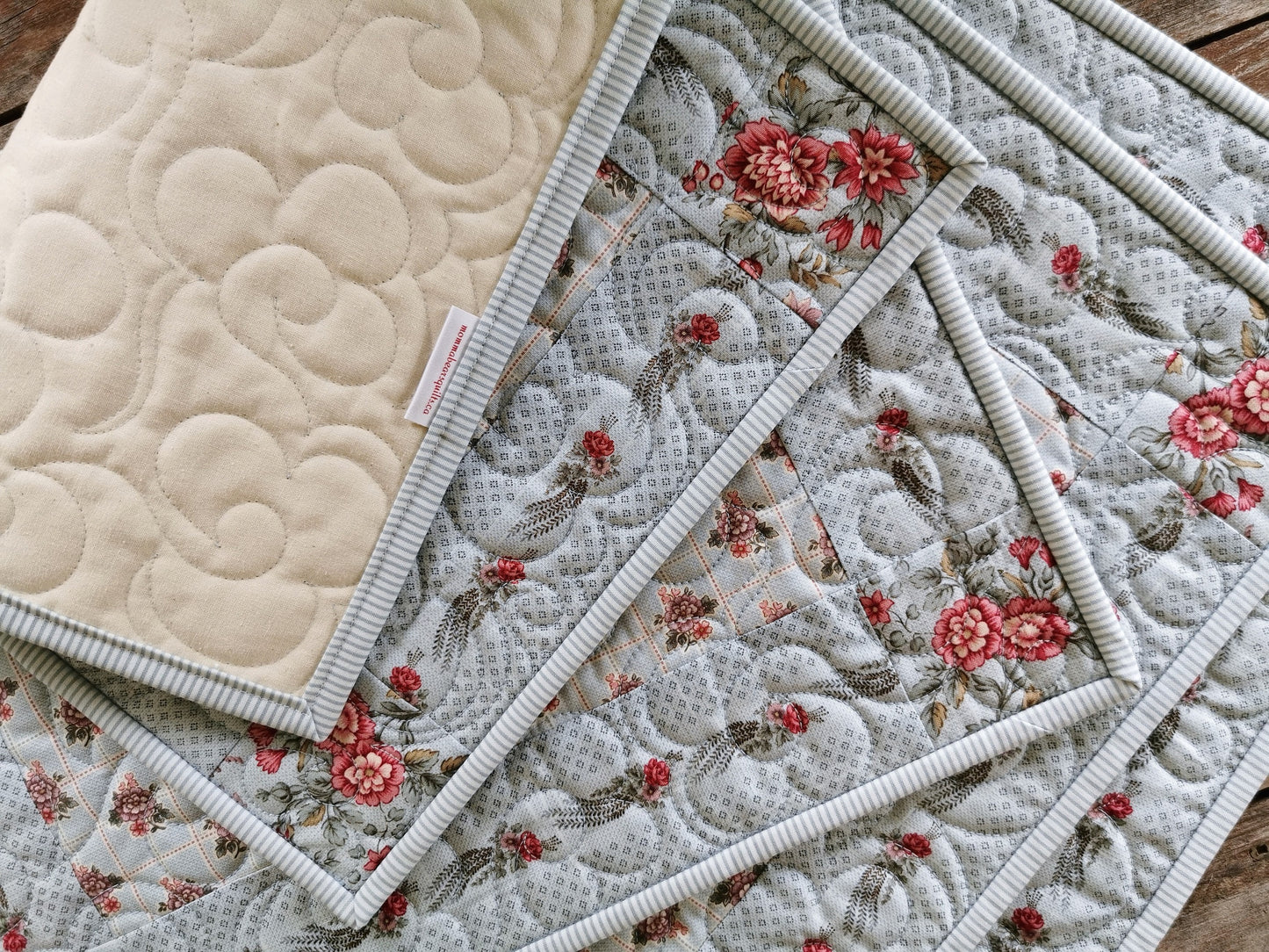 The quilted placemats have a plain muslin backing shown here. 