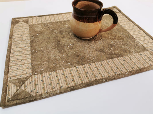 quilted placemat with coffee mug showing scale