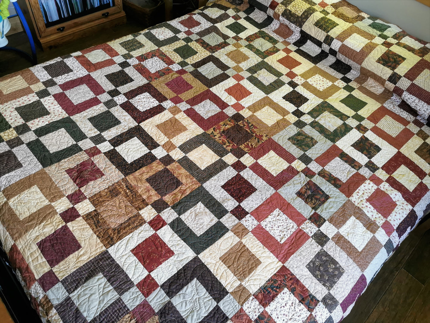 angled top view of the quilt on q queen bed