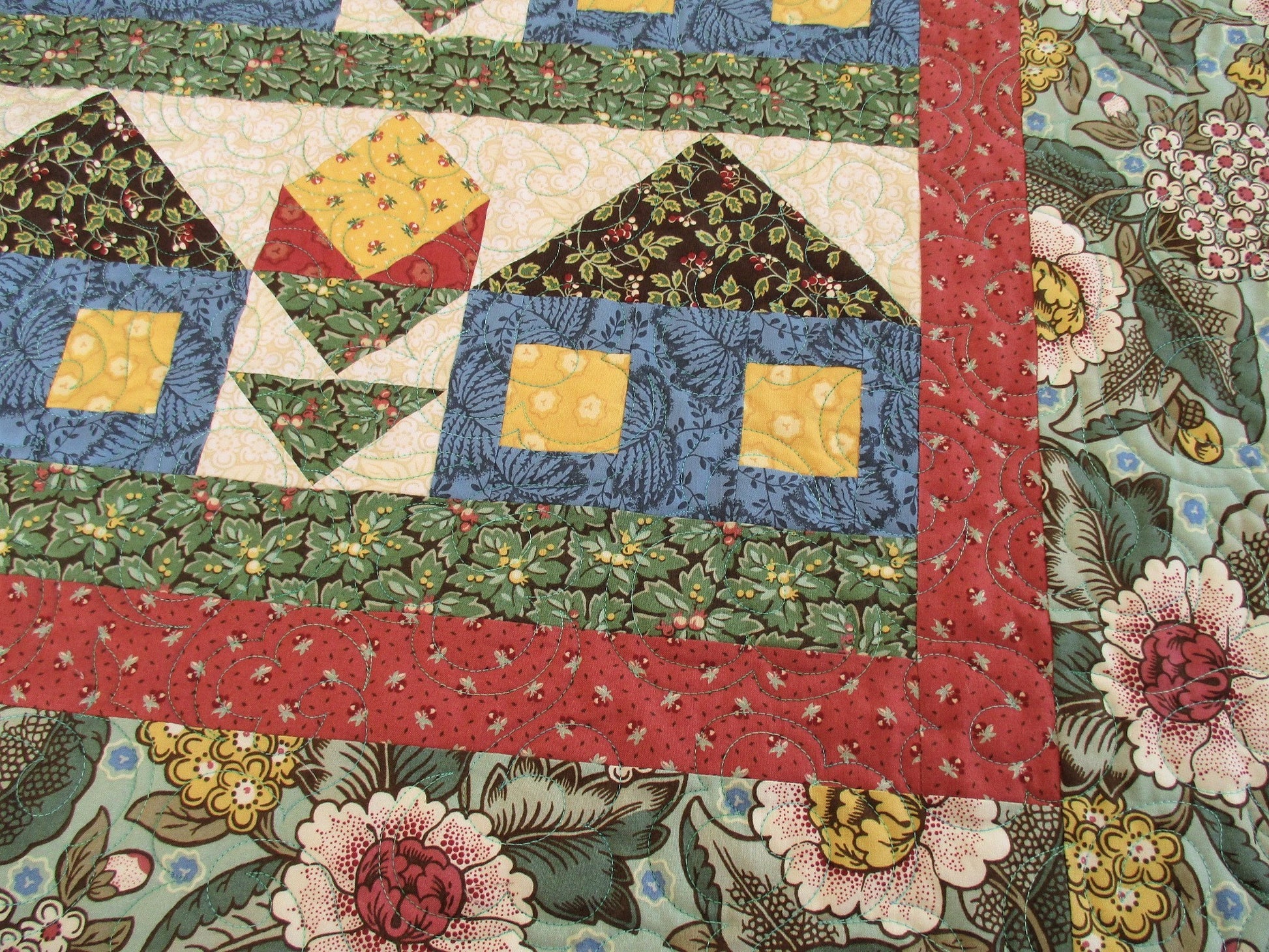 patchwork houses and flowers in floral fabrics