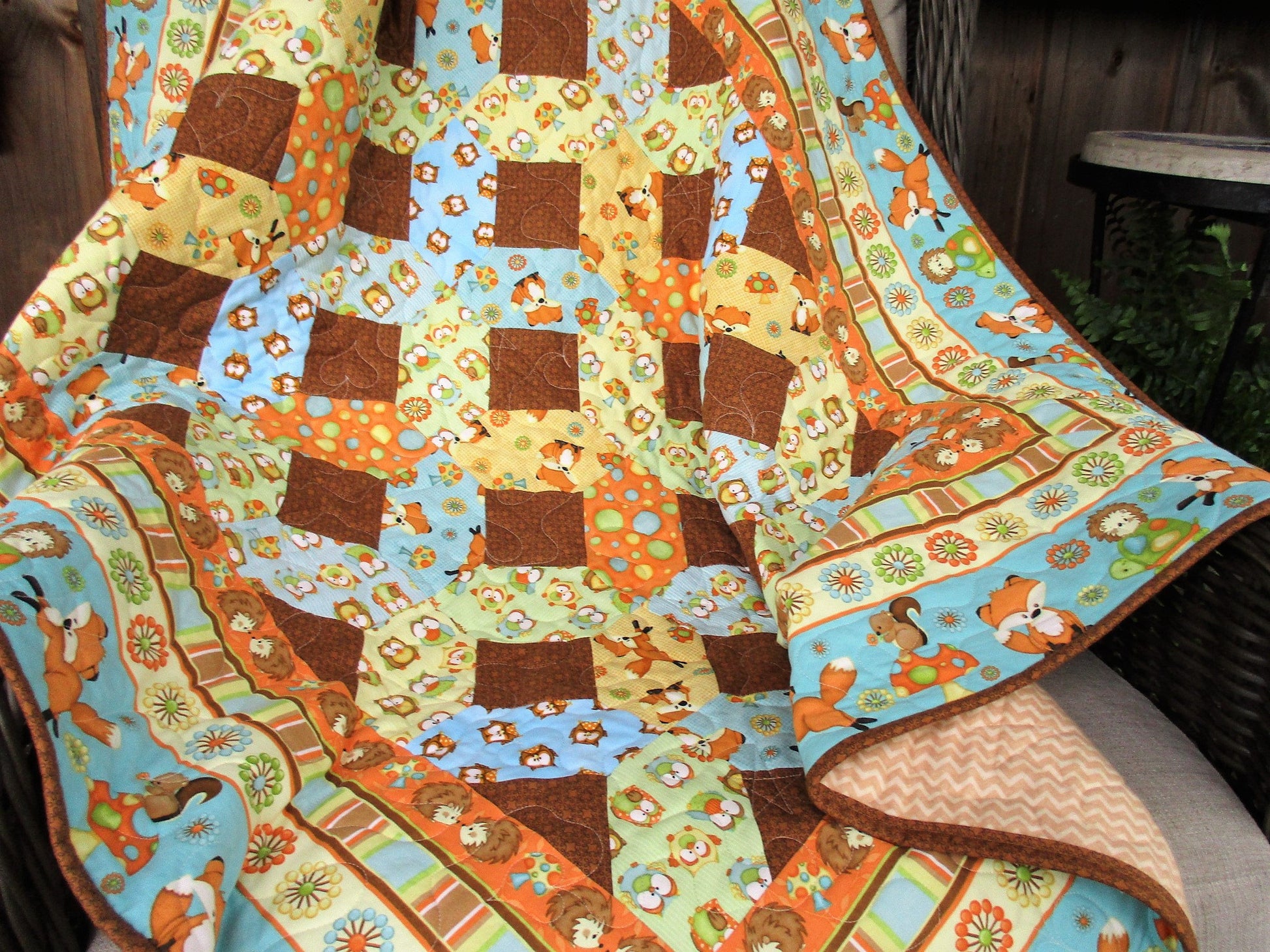 quilt draped over a chair