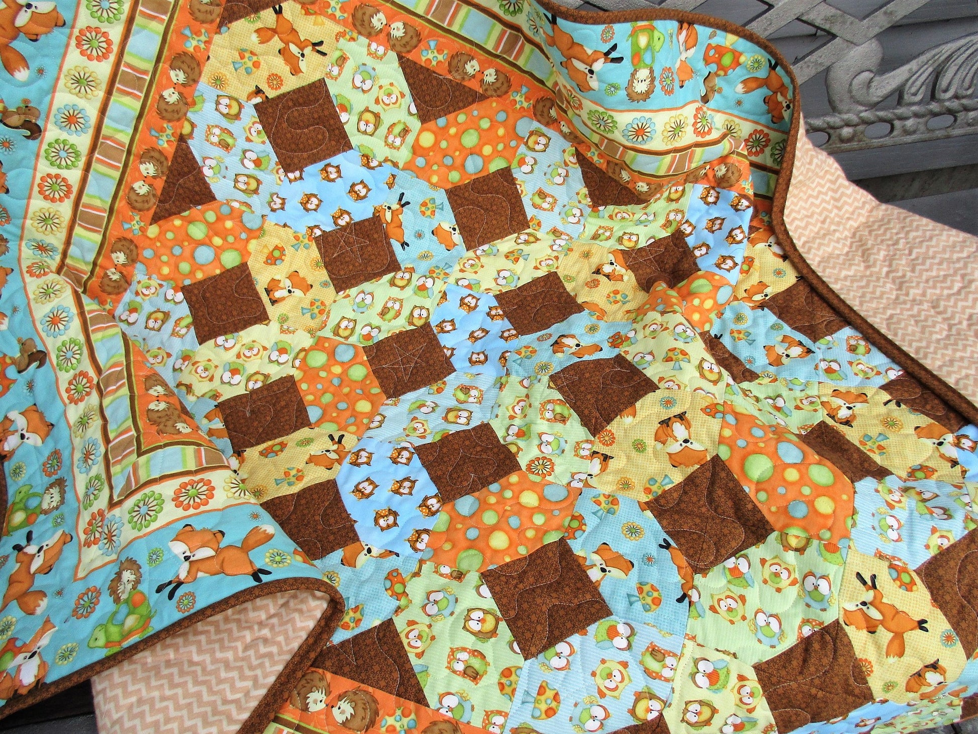 quilt draped on bench showing some of the flannel backing