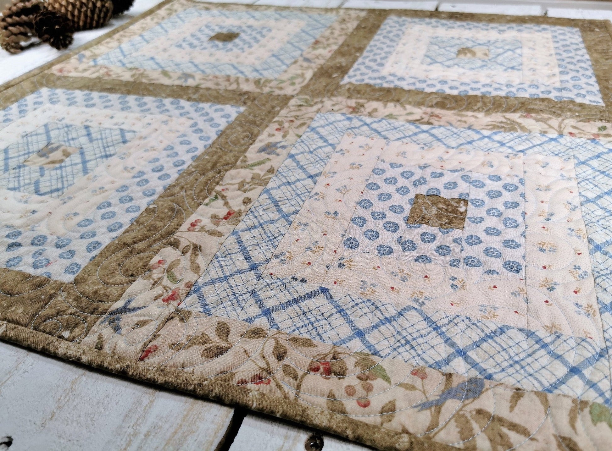 angle view of the quilt showing a close up of the fabrics