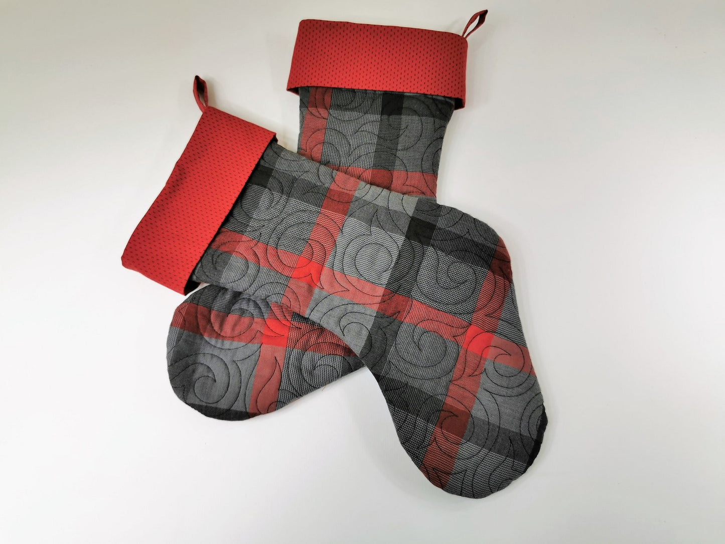 showing two matching christmas stockings that are available