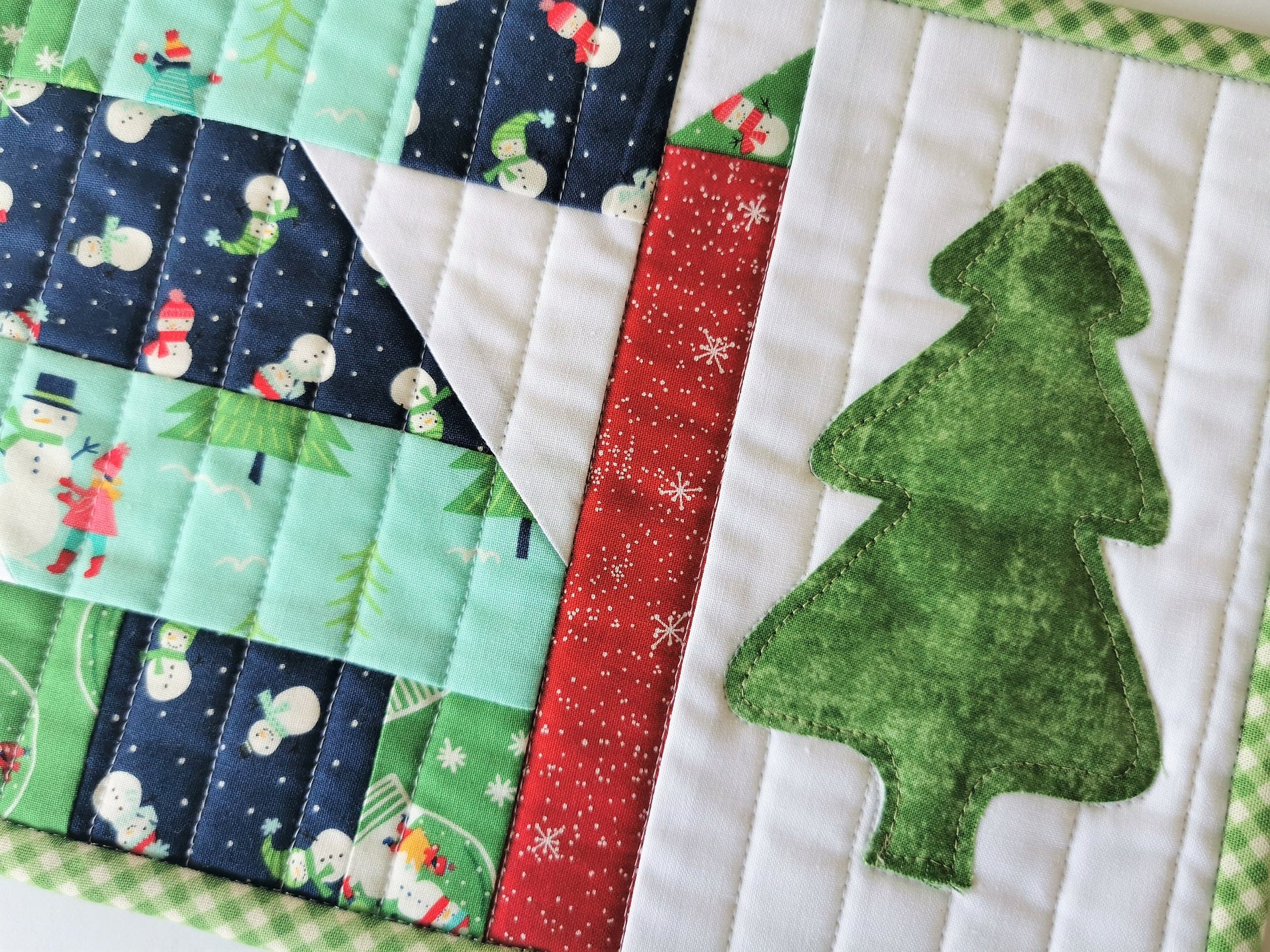 scrap quilt patchwork and appliqued tree make a cute christmas snack mat