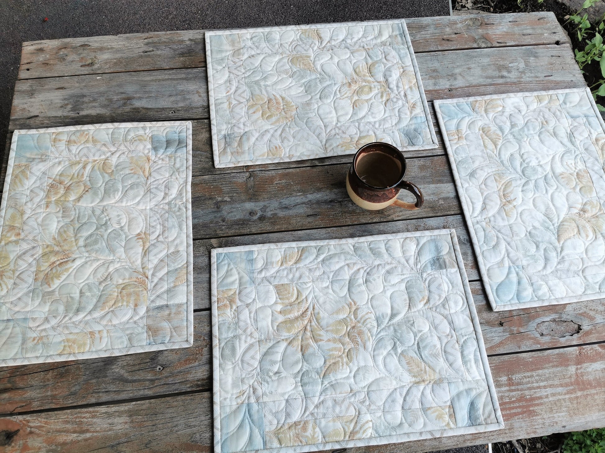 Four neutral dining table mats