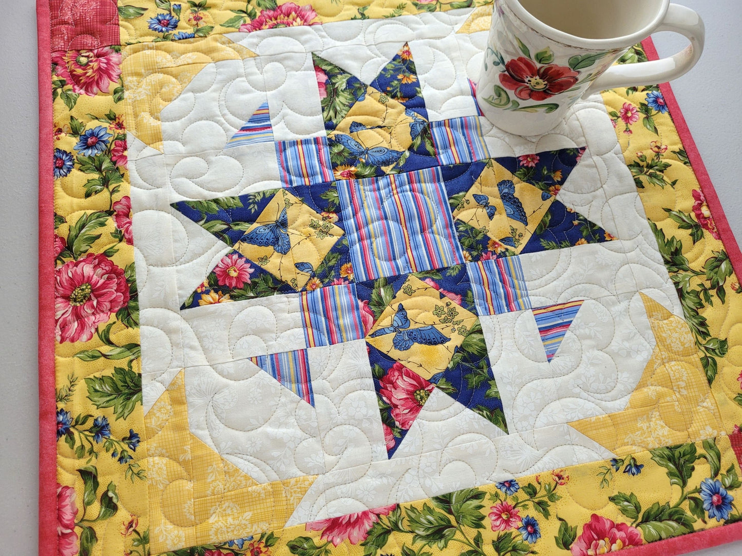 square table runner in yellow, pink and blue florals