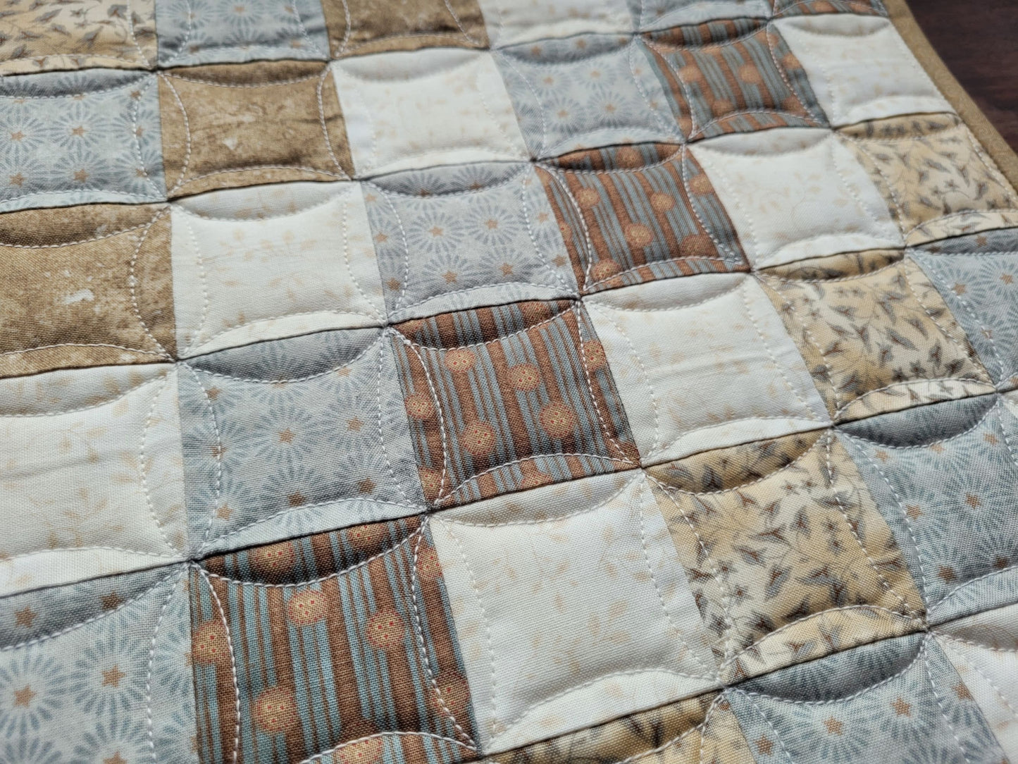 patchwork scrap quilt in beige and green