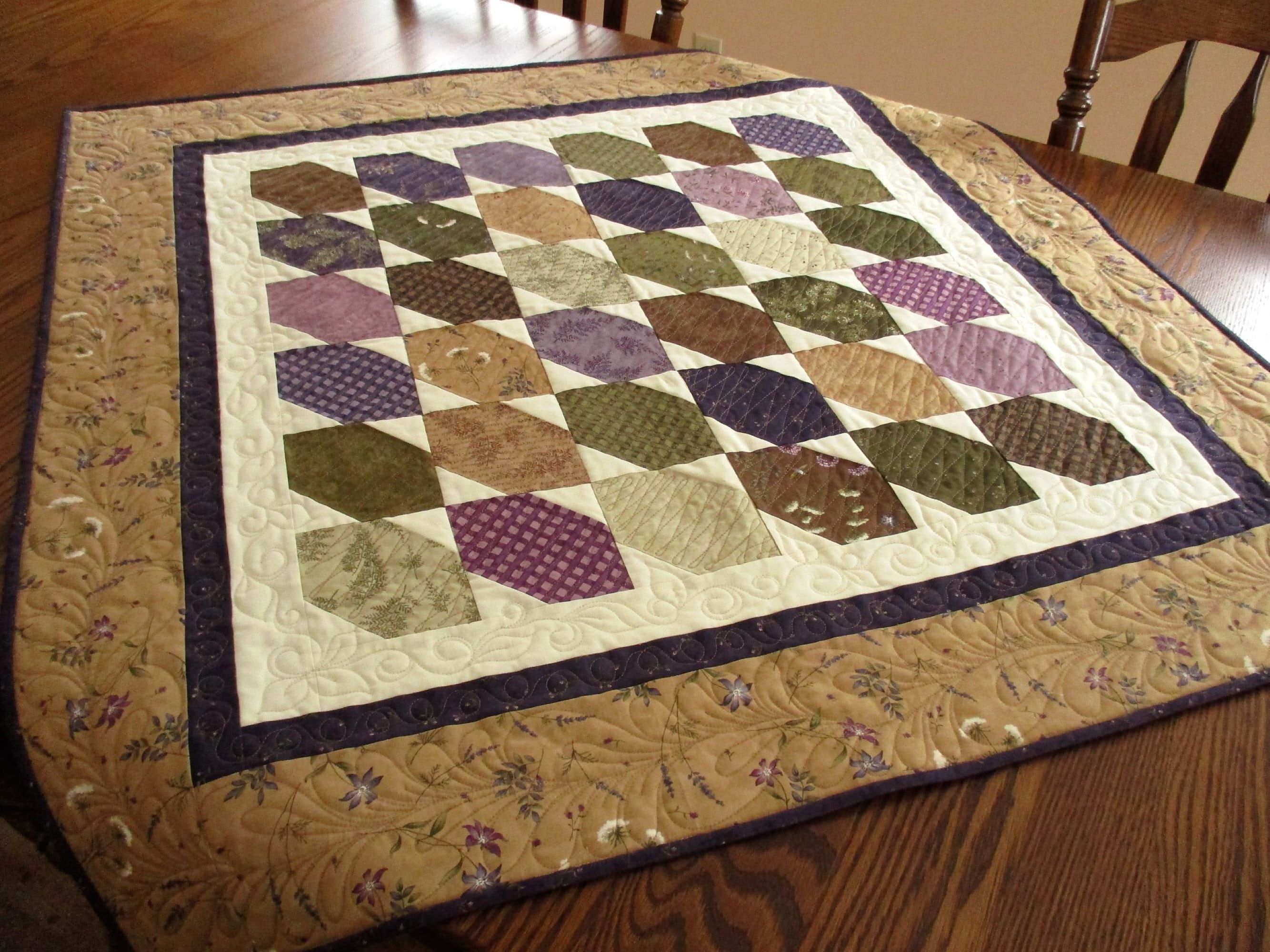 quilted table runner in rustic brown, purple and green