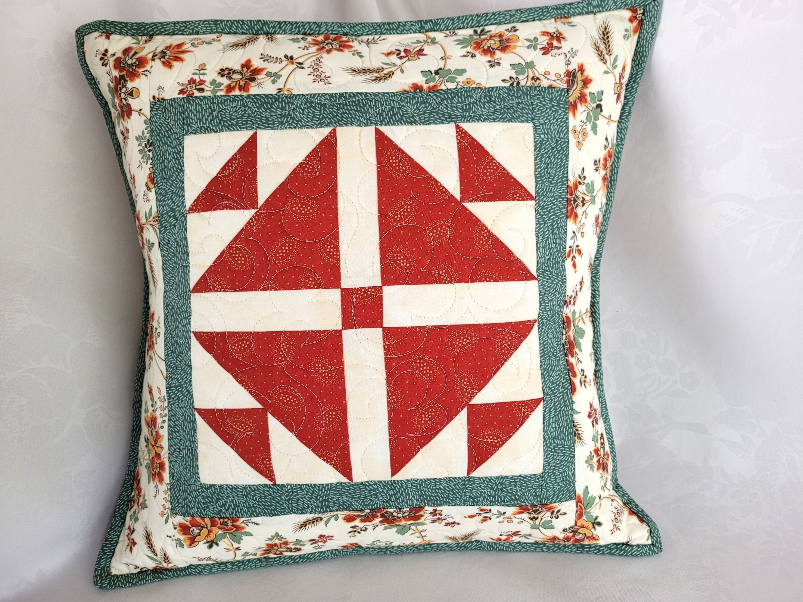 patchwork pillow in red, white and teal