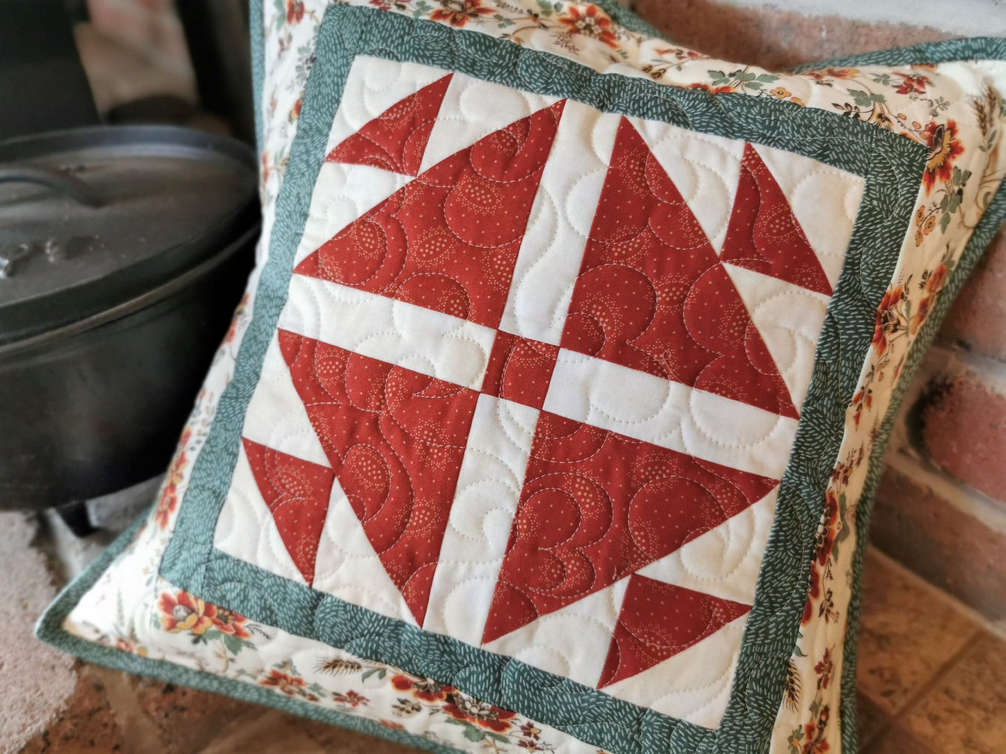 red and white patchwork pillow
