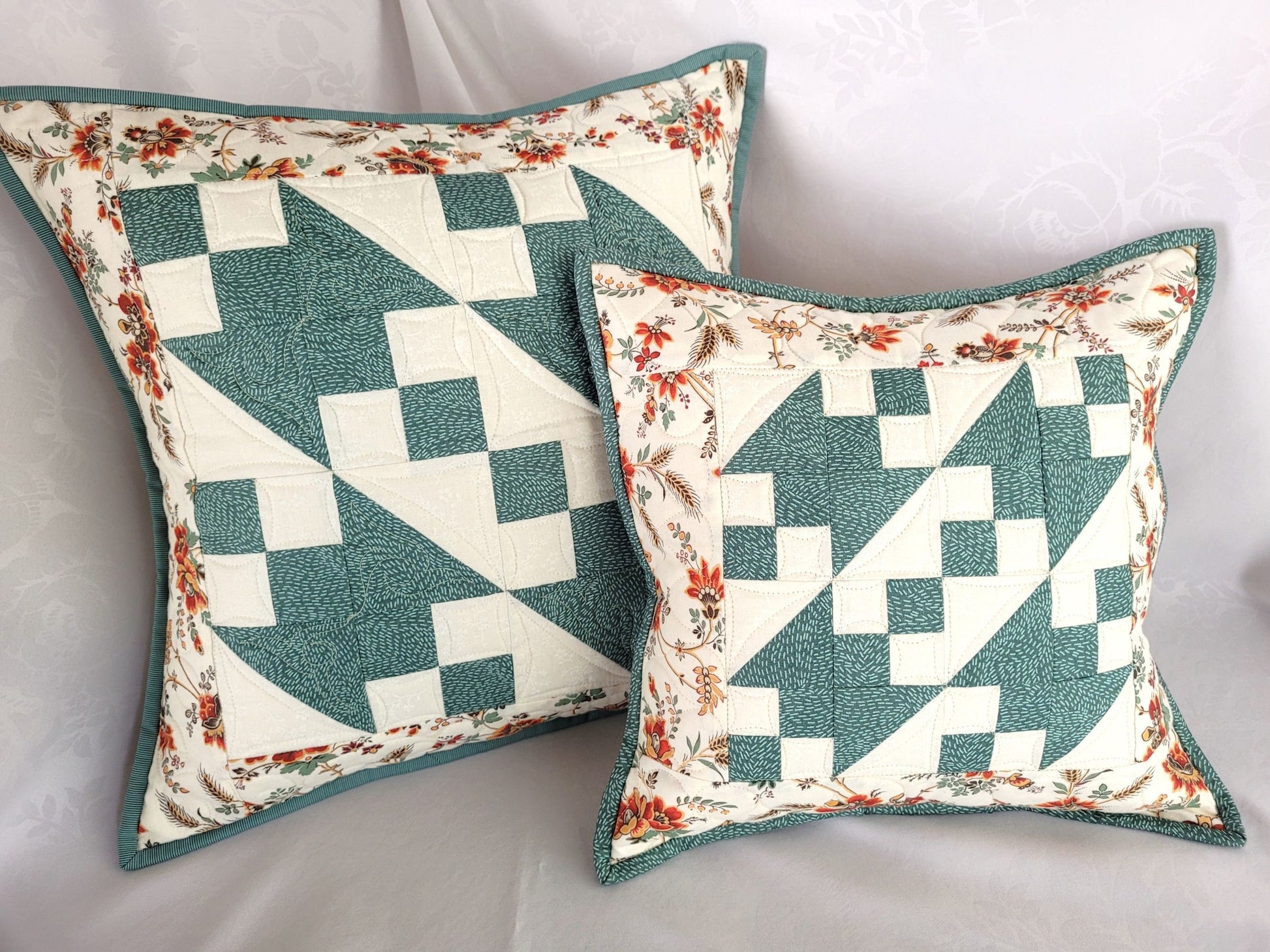 patchwork pillow in teal and white