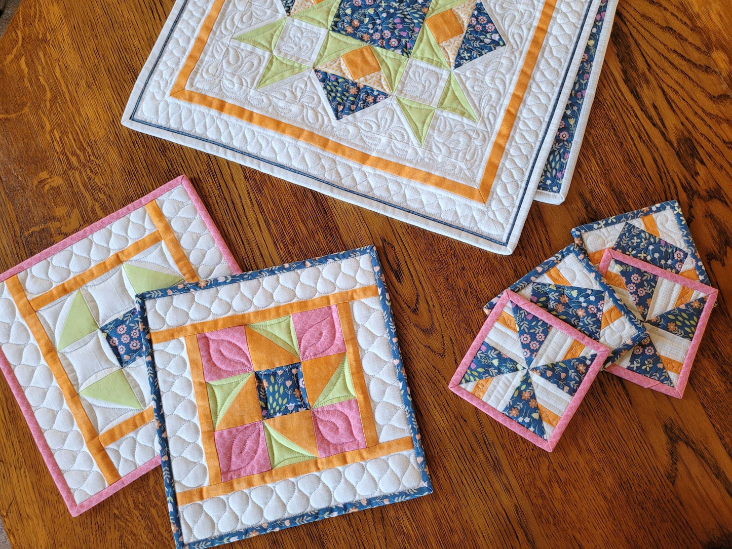 quilted coasters with matching table runner and hot mats