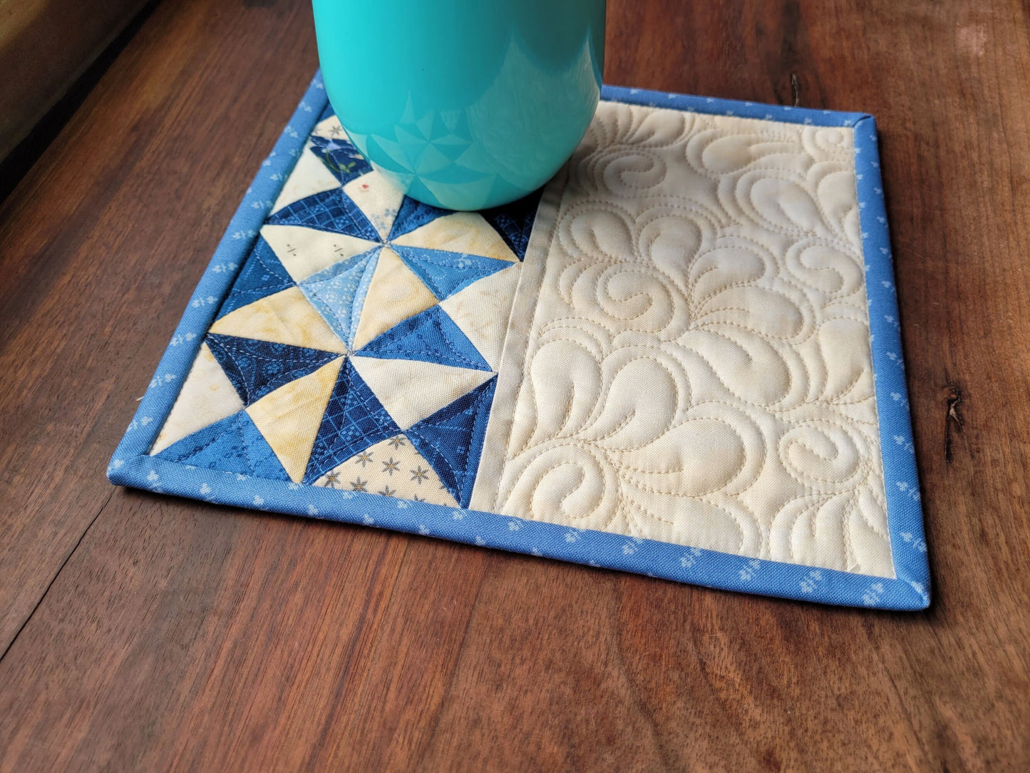 blue mini quilt mug rug with light blue binding