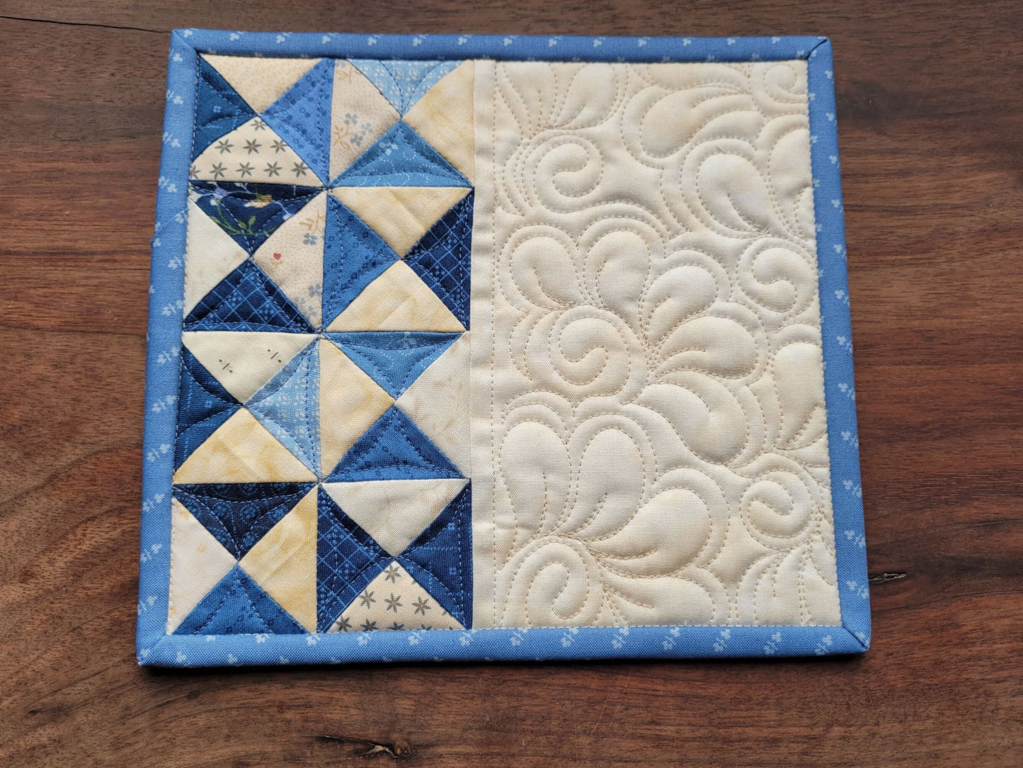 blue patchwork mini quilt with light blue binding
