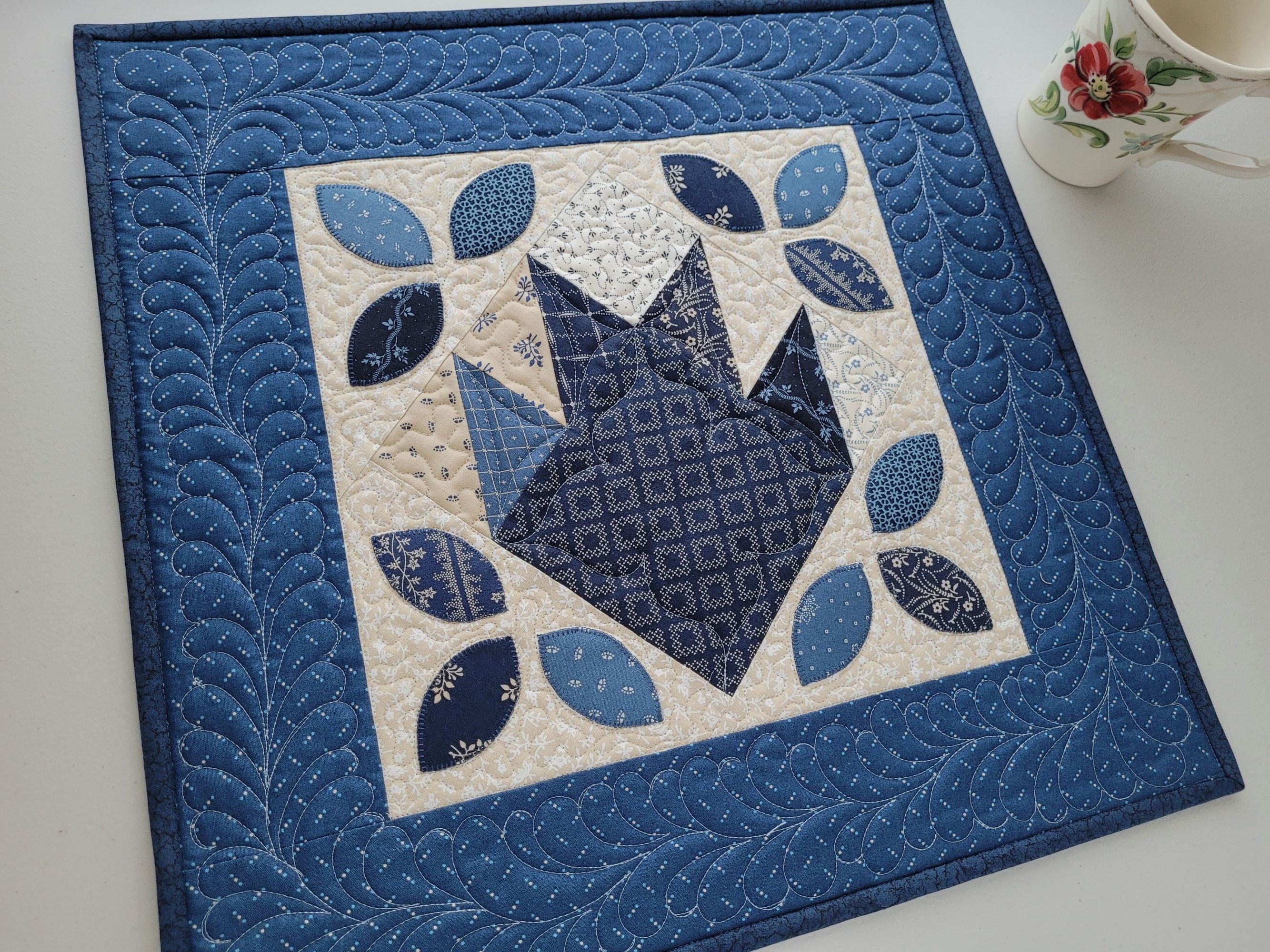 small square bear paw quilt in blues and creams