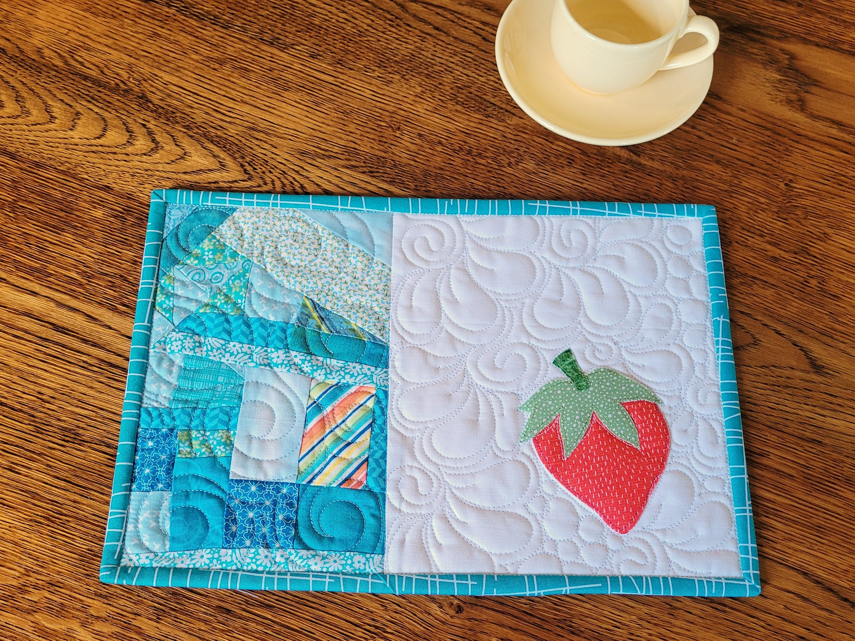 quilted mug rug with strawberry