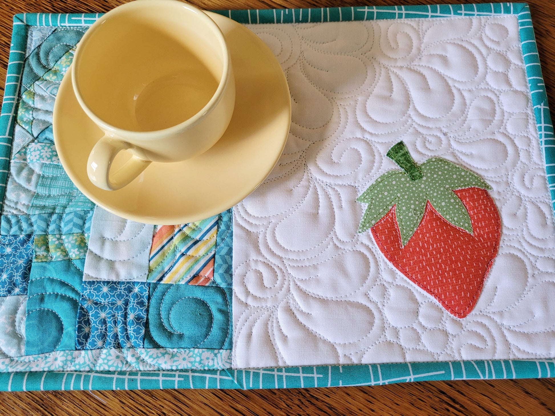 mini quilt with strawberry