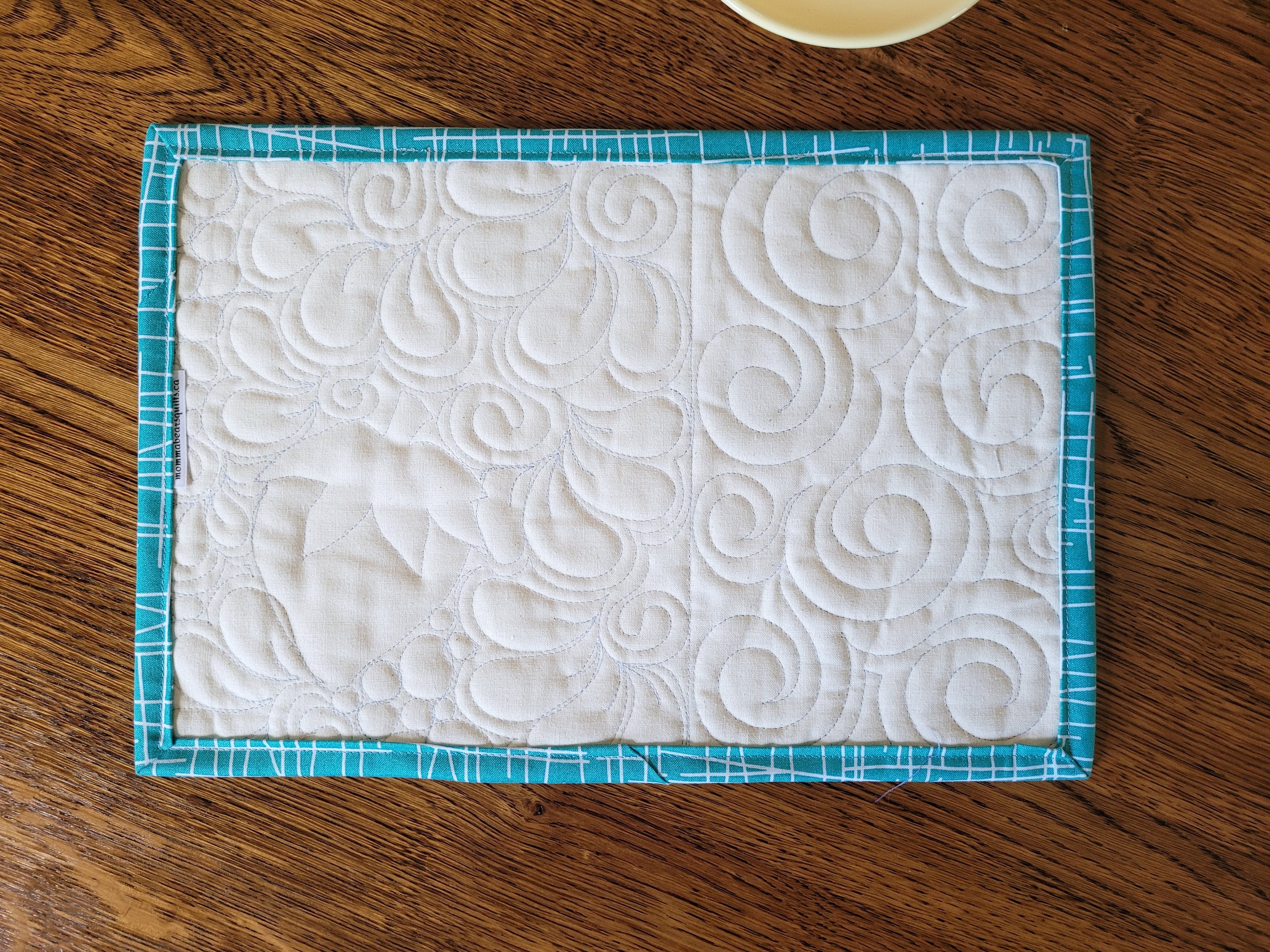 showing back of mini quilt