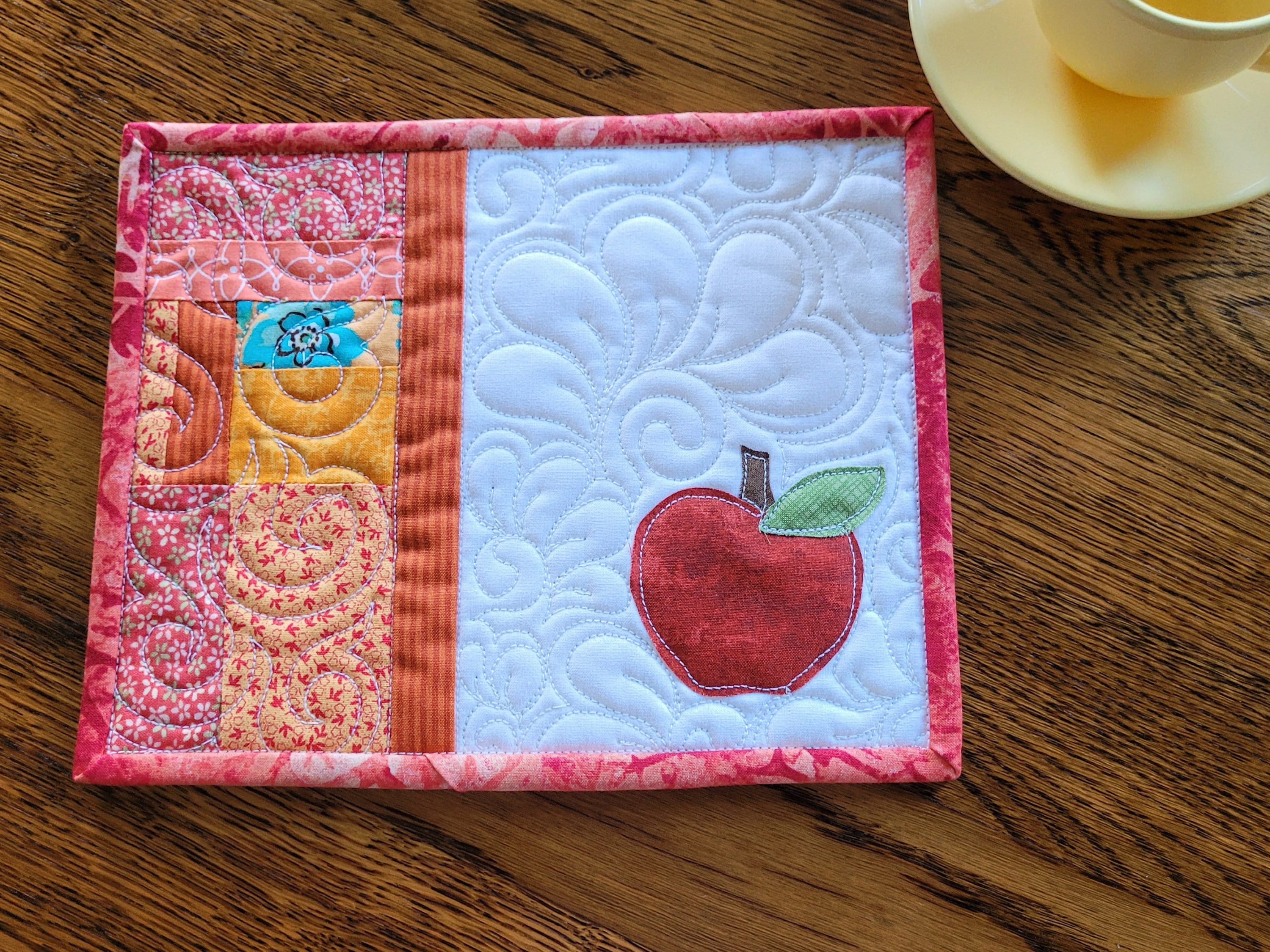 patchwork fabric mug rug with applique apple