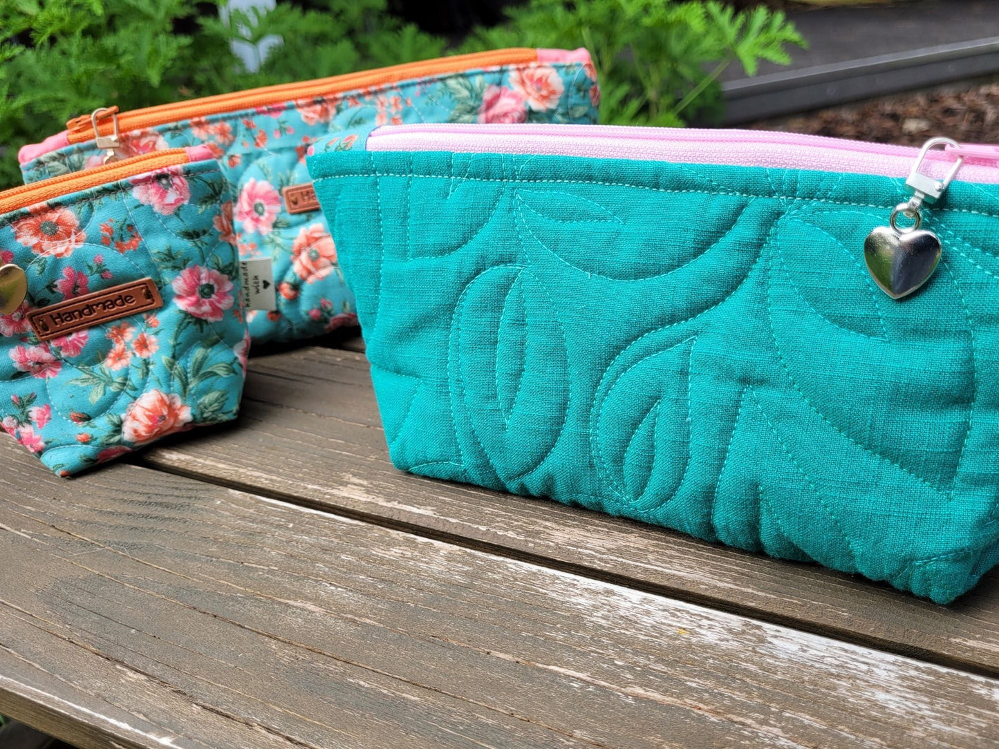 quilted detail on teal pouch