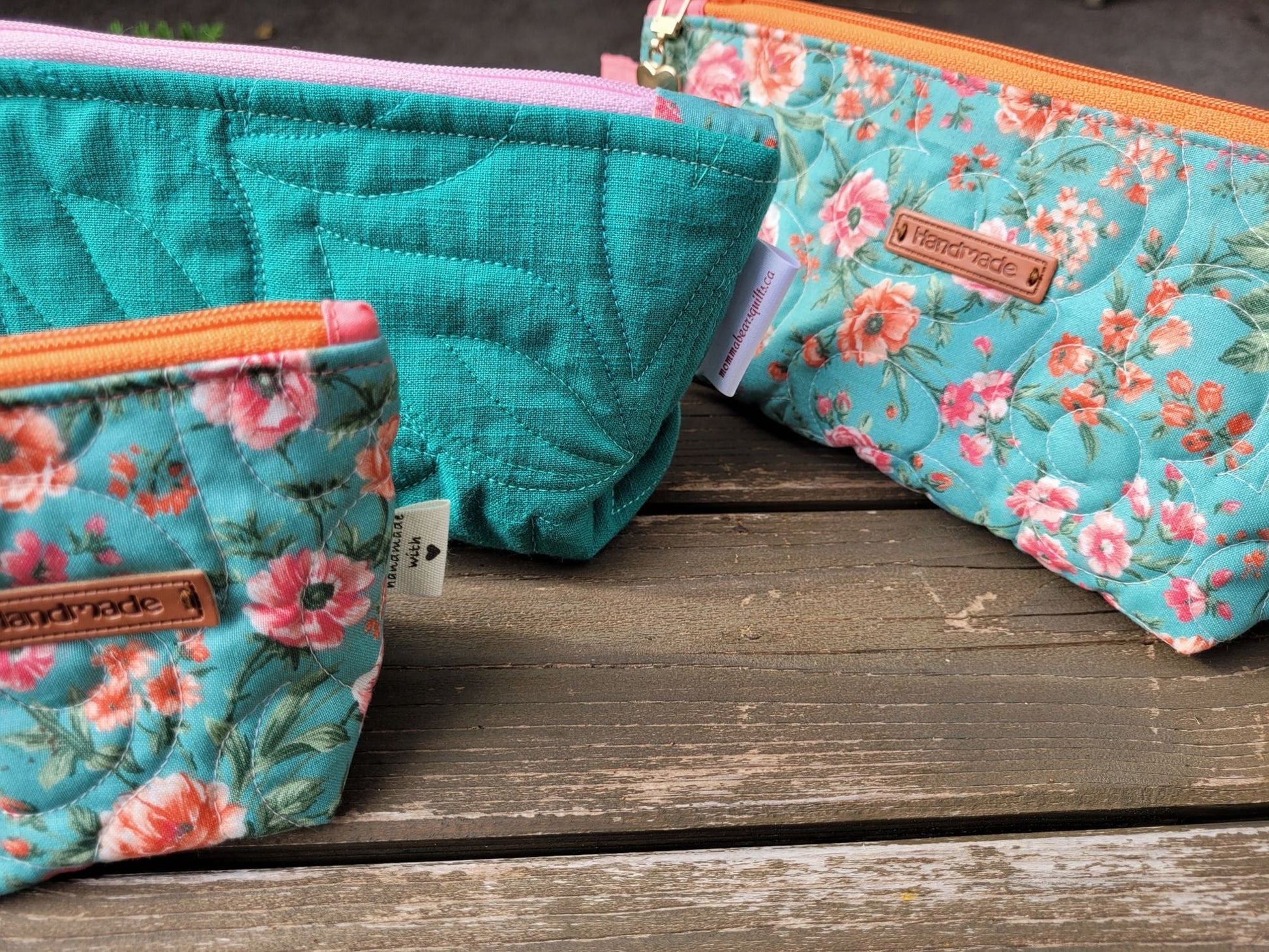 three quilted pouches