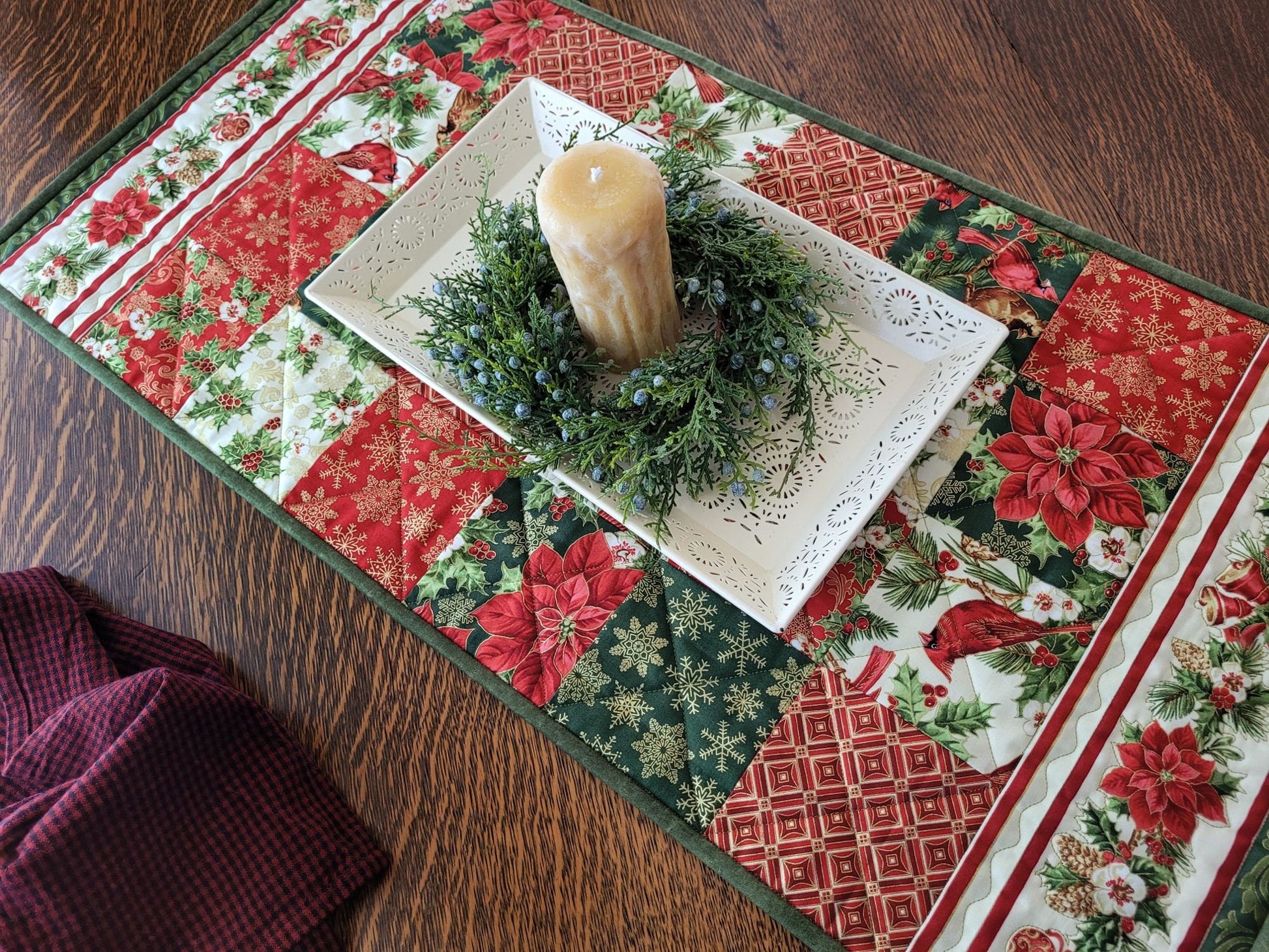 holiday table runner with poinsettias and cardinals
