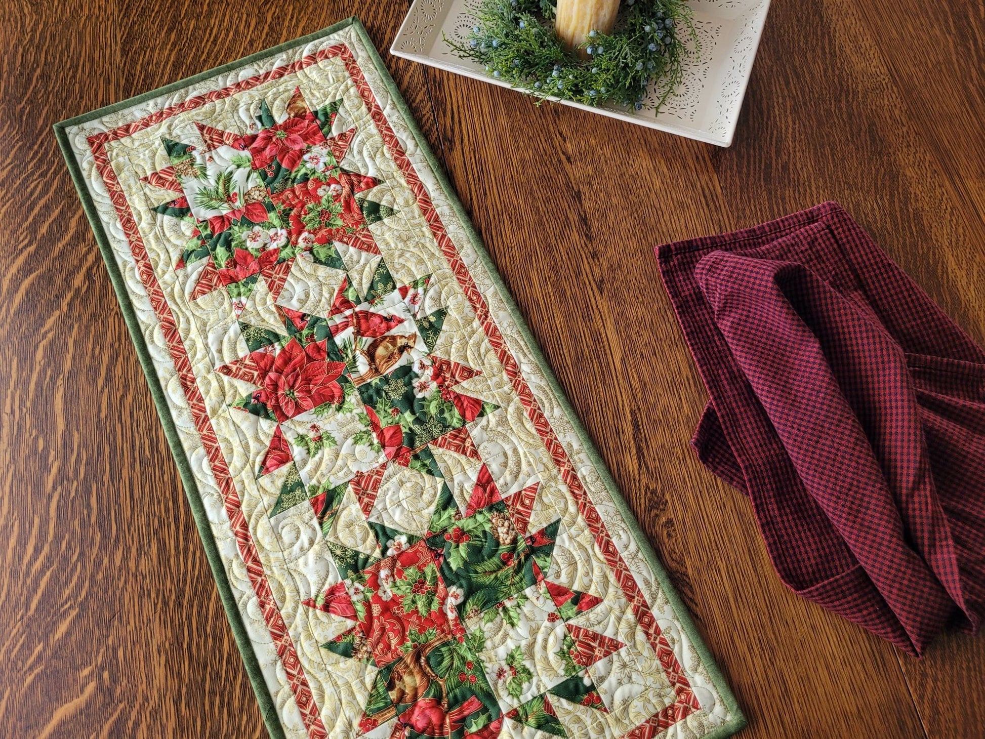 bear paw table runner with poinsettias and cardinals