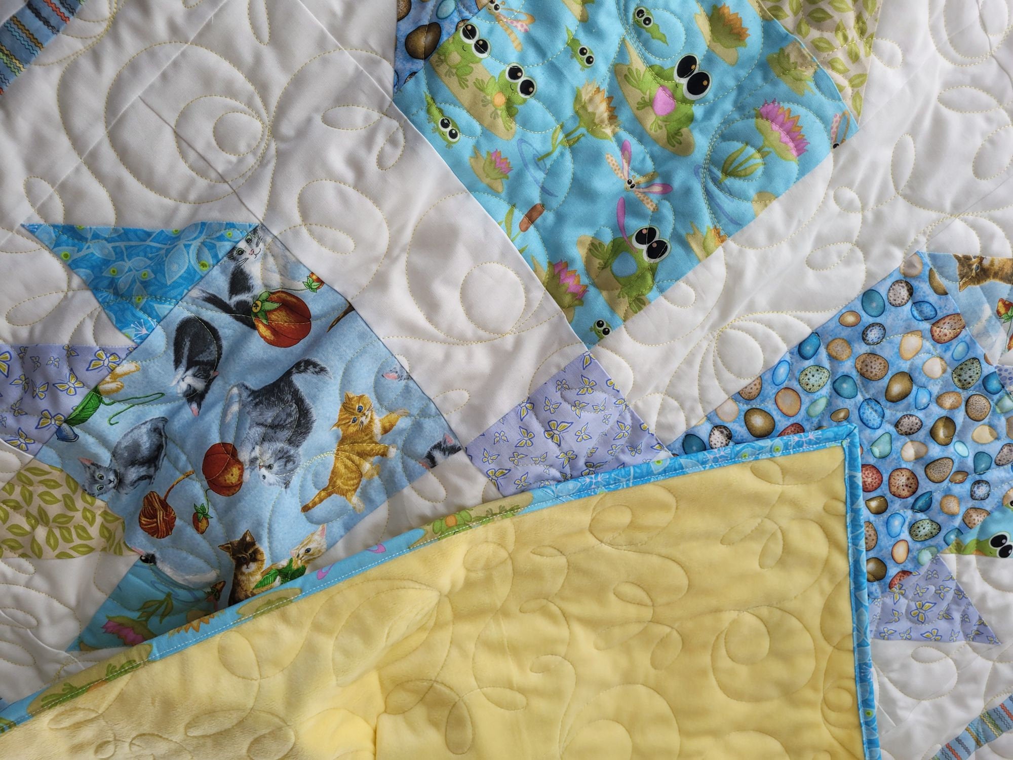 animal theme baby quilt with soft yellow minky backing
