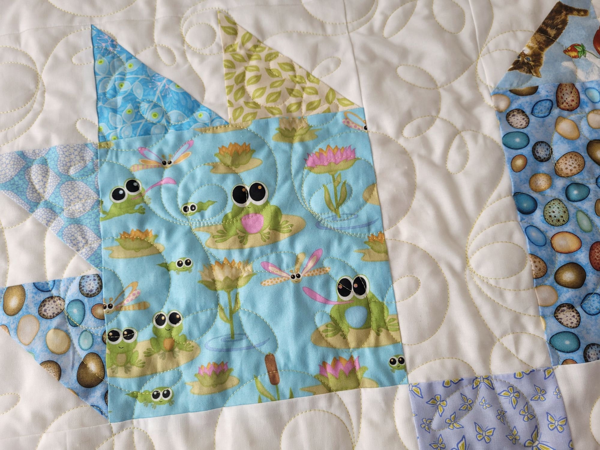 cute baby quilt with frogs and other animal theme fabrics